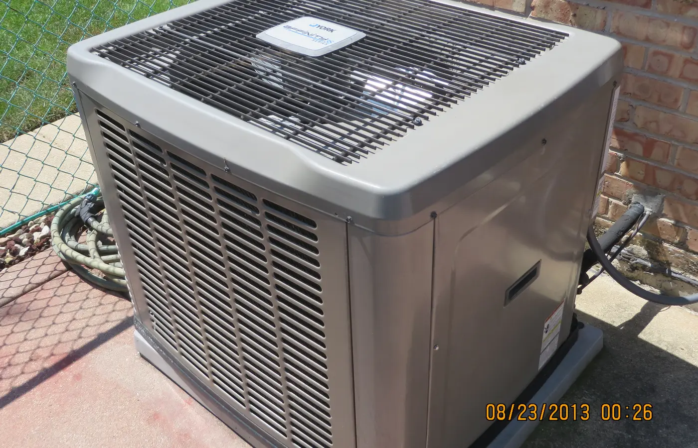 Condenser unit for central air conditioning outside a house